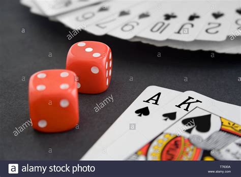 Playing Cards And Dice On Black Surface Stock Photo Alamy