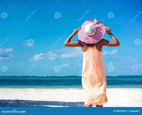 Model Girl In Colorful Cloth And Sunhat Behind Blue Beach Stock Image Image Of Shiny Resort