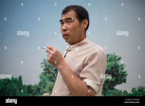 Chinese Man Smoking Cigarette In Beijing China Stock Photo Alamy