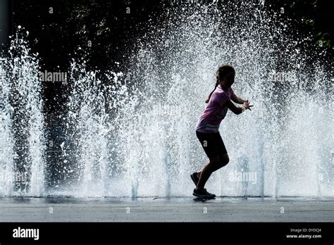 Girl Running Water Fountain High Resolution Stock Photography And