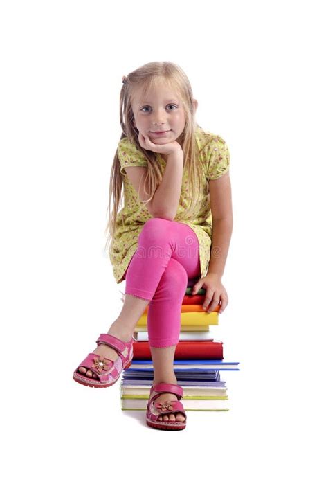 Back To School Girl Sitting On A Stack Of Books Stock Photo Image Of