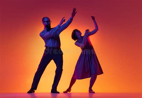 Portrait Of Excited Man And Woman Couple Of Dancers In Vintage Retro Style Outfits Dancing