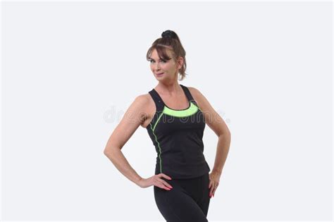 Attractive Middle Aged Woman In Sports Gear Posing And Facing The
