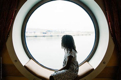 Black Girl Looking Out A Cruise Ship Window By Stocksy Contributor Gabi Bucataru Stocksy