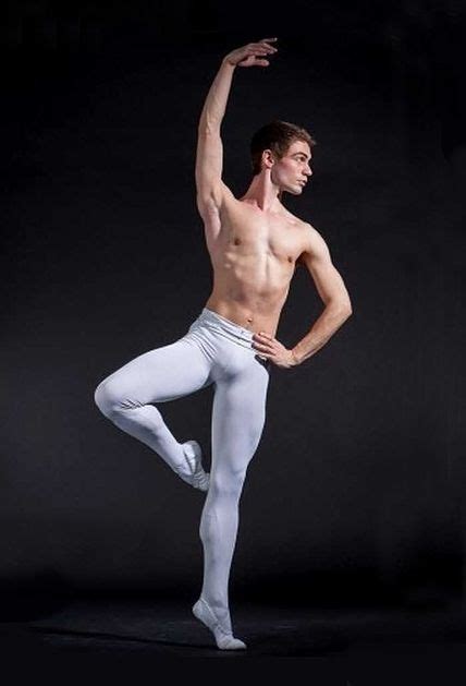 a man in white tights and no shirt is posing with his arms out to the side
