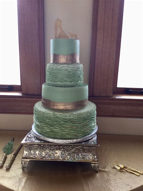 We are so excited to share in your big day. Mint Green and Gold Brushed Buttercream iced wedding cake ...
