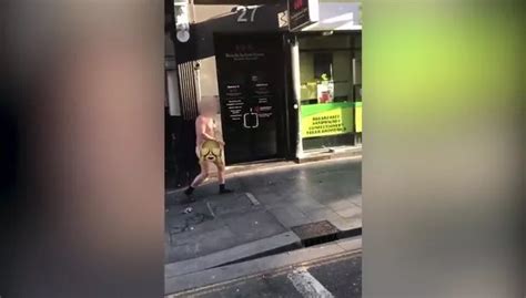 Naked Man Filmed Walking Down High Street Wearing Nothing But Socks And