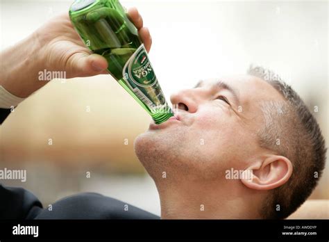 Businessman Drinking Mineral Water Stock Photo Alamy