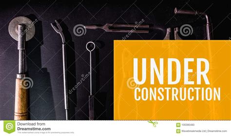 Under Construction Message On Images Of Tools Laid On Table Stock Image