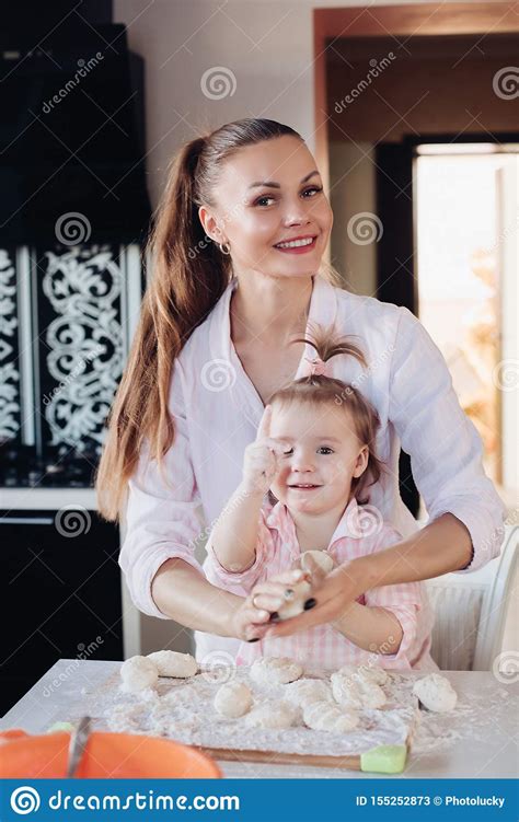 Beautiful Loving Mother And Pretty Daughter Cooking Together In The Kitchen Stock Image Image