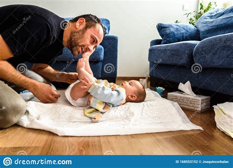 Father Changing His Daughter S Dirty Diaper Stock Photo Image Of