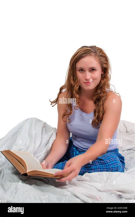 Woman Reading In Bed Stock Photo Alamy