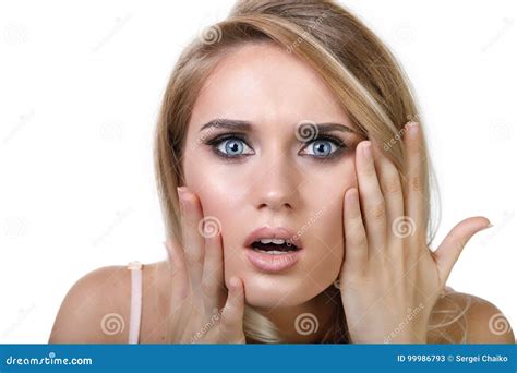Young Girl Is Anxiously Holding Her Hands Near Her Face Stock Image