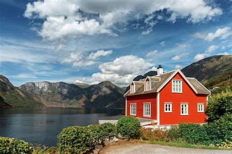Premium Photo Typical Norwegian Red House In The Background Of A