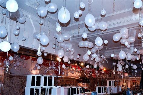 Pull the balloon tails through the small holes in the foam core until the knot pops all the way through. New Year's #Balloon Ceiling #Decorations for New Year's ...