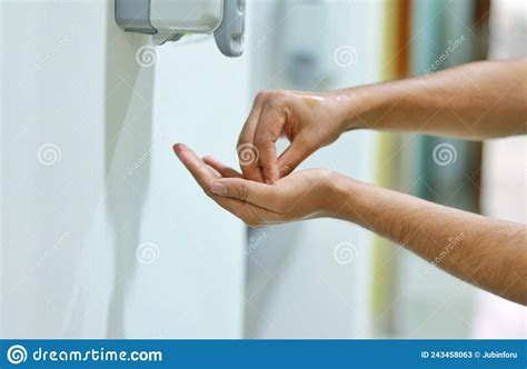 A Healthcare Worker Rubbing The Tip Of The Fingers With Alcohol Based