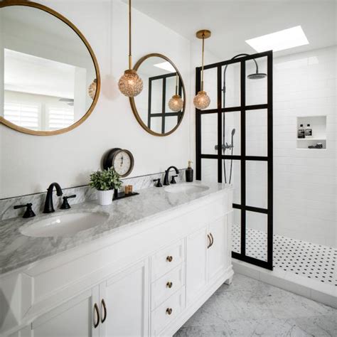 Today i'm sharing some stunning bathrooms that all feature gold hardware and/or gold bathroom fixtures. White Bathroom Vanity and Gold Pendants | HGTV
