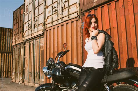 Redhead Woman Leaning On A Motorcycle By Branislav Jovanović