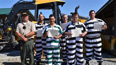 Walton County, Florida inmates graduate from heavy machinery program