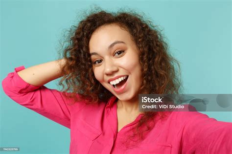 Close Up Selfie Shot Of Excited African Girl In Casual Clothes Putting Hand On Head Isolated On