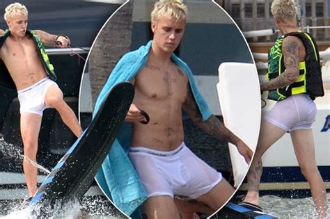 justin bieber flashes bum in soaking white pants as he gets wet and wild on fourth of july