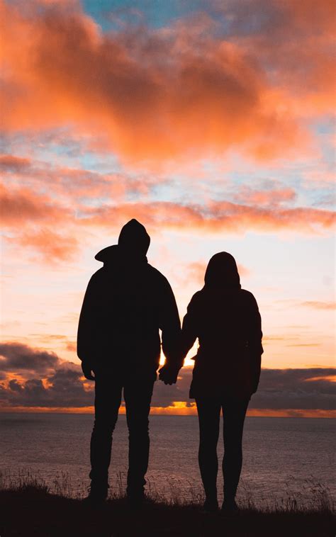Download 1600x2560 Couple Silhouette Romance Sunset Sky Wallpapers