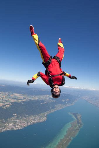 158292907 Female Skydiver Upside Down In The Sky Gettyimages 338×