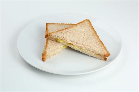 Premium Photo Sandwich With Ham And Salad On Wholegrain Toasted Bread In White Plate Isolated