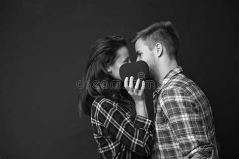 couple kiss behind heart happy valentines day love and romance man and girl kiss on love date