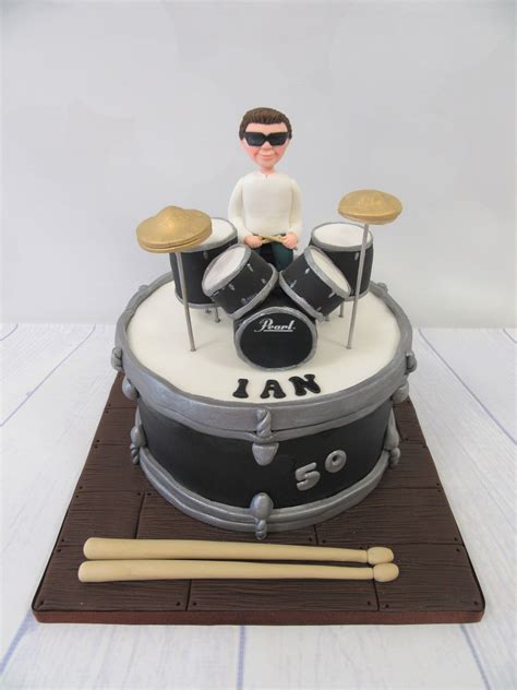 A Birthday Cake With A Drummer On It