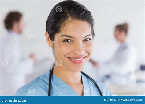 Portrait Of Confident Nurse Stock Photo Image Of Mixedrace