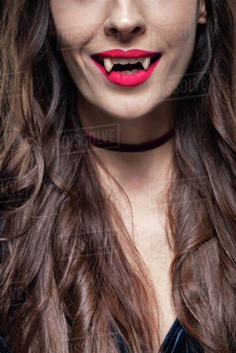 Cropped View Of Woman Showing Vampire Fangs Stock Photo Dissolve