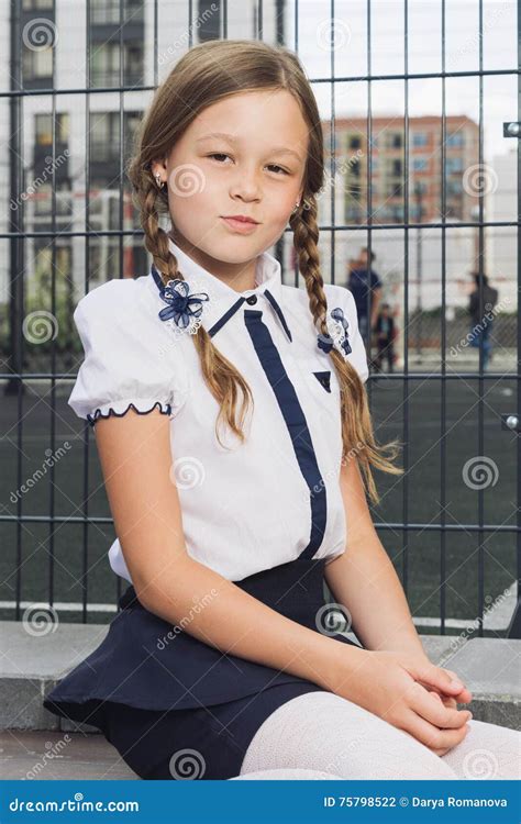 Cute Elementary Schoolgirl In Uniform At Playground Stock Photo Image Of Portrait Blouse