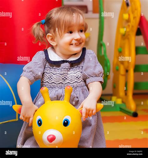 Little Girl Playing In Colorfull Balls On Playground Stock Photo Alamy