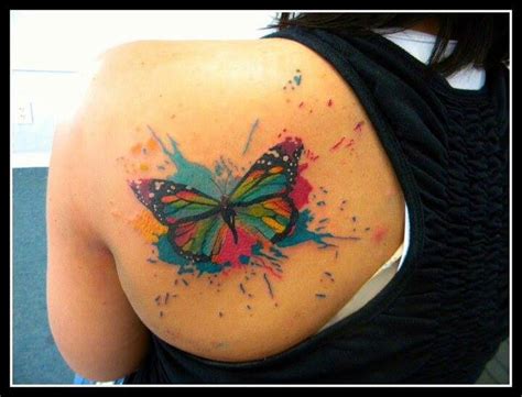 A longer lotus flower tattoo fits well on a foot. colorful butterfly tattoo | Tattoos | Pinterest