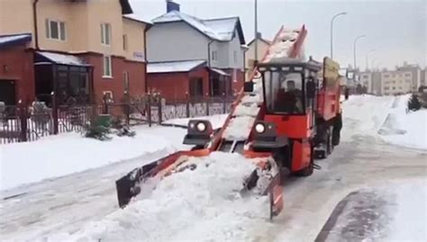 Video Shows Golden Hands Snow Guzzling Machine That Clears Russias
