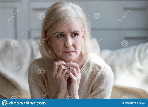 Thoughtful Upset Mature Lady Crying Thinking Of Loneliness Or Gr Stock