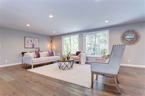 Spacious White Living Area With Hardwood Floor Connections Network