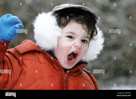 Toddler Boy Playing In Snow Stock Photo Alamy