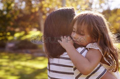 Loving Mother Hugging Son In Park Stock Photo Crushpixel
