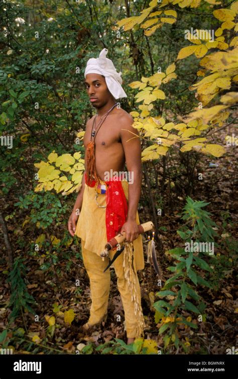 Young Cherokee Man Dressed In Traditional Buckskin Leggings And
