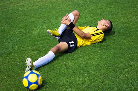 Injured Football Player Screams In Pain Stock Photo Download Image