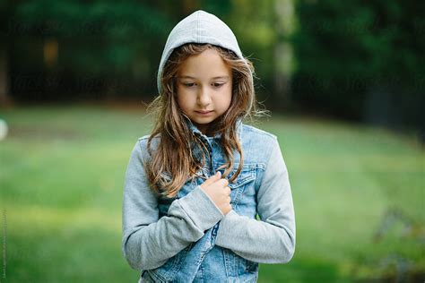Portrait Of A Cute Young Girl In A Hooded Denim Jacket By Stocksy Contributor Jakob