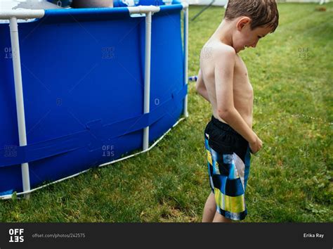 Babe Babe Peeing By Pool In Backyard Stock Photo OFFSET