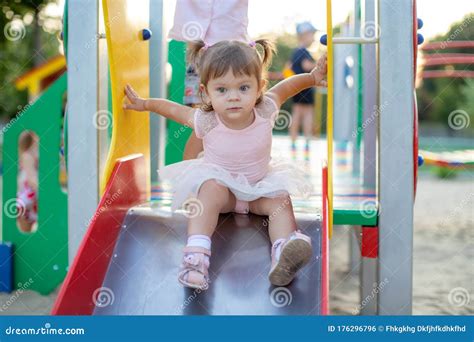 Cute Toddler Girl Playing In Sand On Outdoor Playground Beautiful Baby