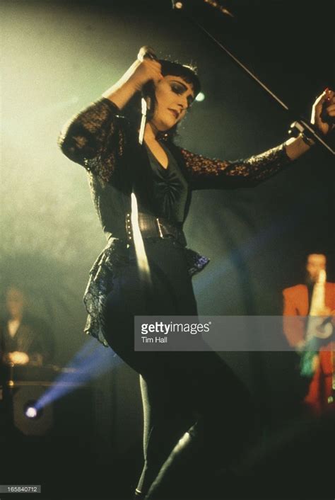 singer siouxsie sioux performing with english rock group siouxsie and the banshees circa 1990
