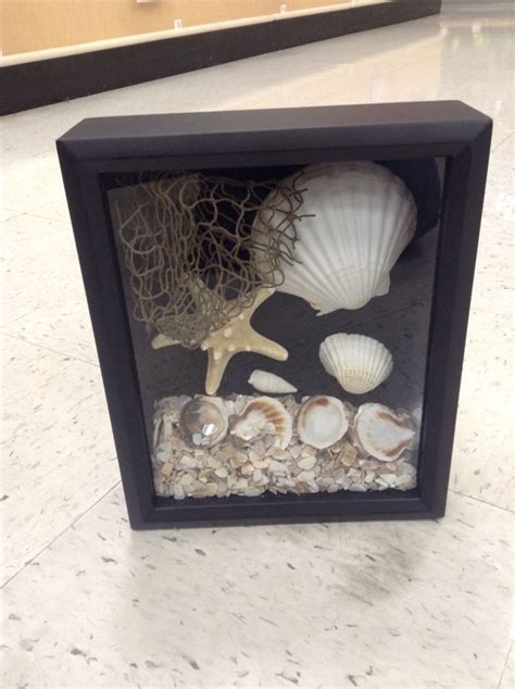 Shadow Box Arrangement With Seashells Sand Starfish And Netting