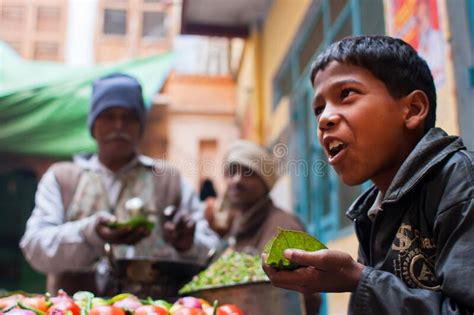 Street Food With Spicy Vegetables For Sale And Poor Hungry People On