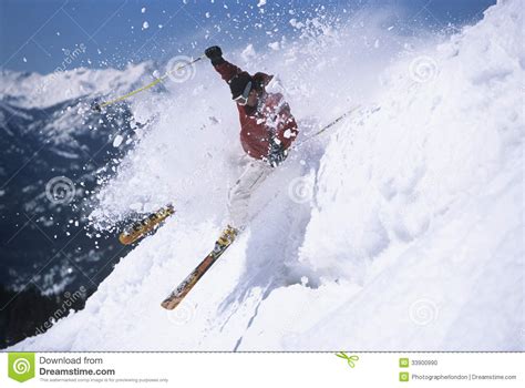 Skier Through Powdery Snow On Ski Slope Stock Photo