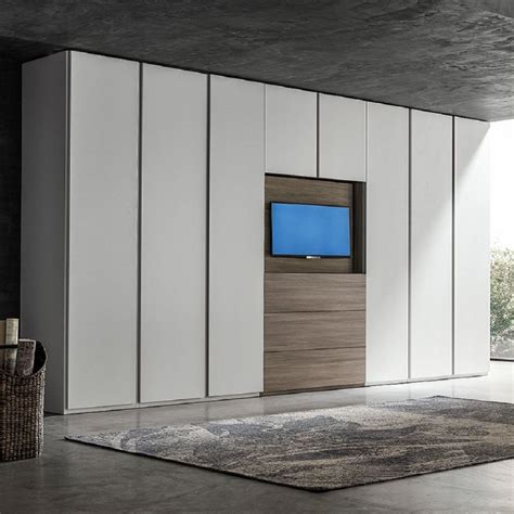 The city 1.2 tv stand offers an organized space for your tv and accessories. Big wardrobe with TV unit 'Hugo' by Santa Lucia | Fitted ...